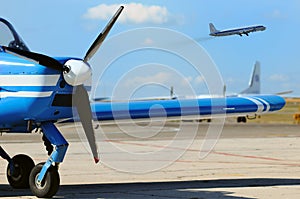 Small propeller airplane at the airfield photo