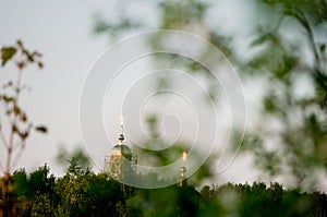 The small provincial village of Ilyinka, a church in smog. Ryazan region, Russia