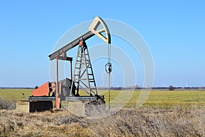 Small Pump Jack in agricultural field