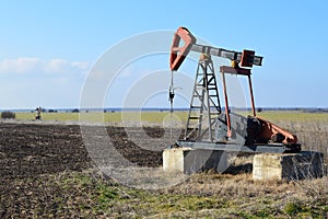 Small Pump Jack in agricultural field