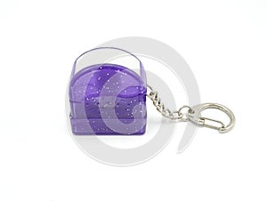 Small purple plastic glitters stamp with metal key ring and chain
