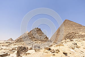 Small Pyramids of Queen Henutsen, Queen Meritetis and the great Pyramid at the backdrop photo