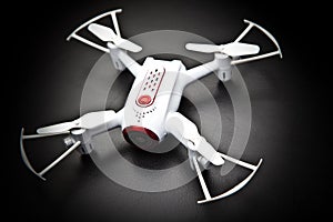 Small Quadrocopter drone robot studio work white