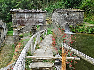Small stone village next to a river in Asturies (Spain) photo