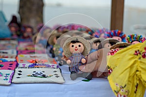 Small rag mexican doll in a street store.