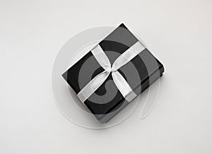 Small rectegular black gift box on a white background