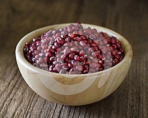 Small red bean or azuki in wood bowl on