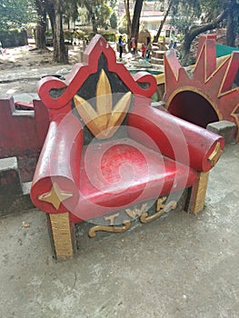 a small red chair in a children& x27;s playground