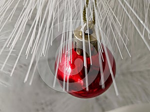 Small red Christmas ball decoration on the Chrismas tree