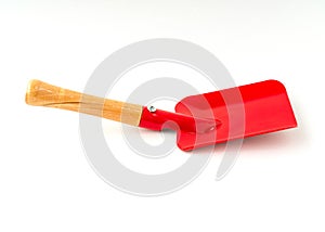 Small red color shovel isolated on white background