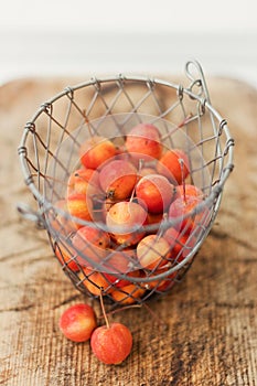 Small red crab apples in basket