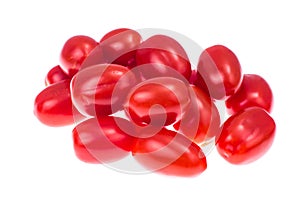 Small red tomatoes on light background