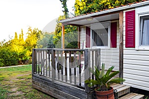 Small red and white cottage hut in the garden in Voula Greece