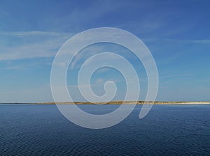 The small reef and the blue sea and blue sky