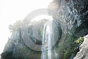 Small refreshing drops fall at Joengbang waterfall in Seogwipo, Jeju Island, South Korea