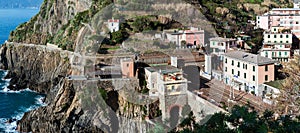 Small regional train station, located between mountains, at Riomaggiore town in Cinque Terre national park, Italy