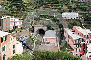 Small regional train station, located between mountains, at Riomaggiore town in Cinque Terre national park, Italy