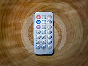 Small remote control on blurry background