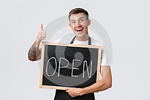 Small retail business owners, cafe and restaurant employees concept. Friendly happy smiling barista, waiter or salesman