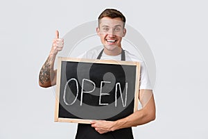 Small retail business owners, cafe and restaurant employees concept. Friendly happy smiling barista, waiter or salesman