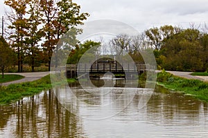 A small river and a bridge at Windmill Island Gardens