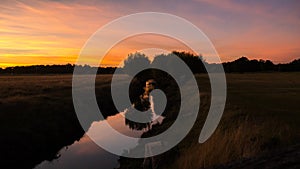 Small River cutting the fields