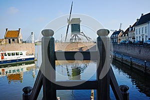 Small river harbor, drawbrige and windmill in Heusden - old vill