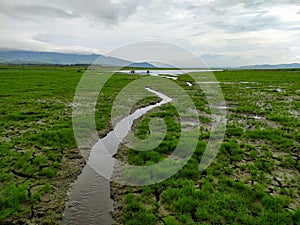 A small river in reservoir whose water recedes.