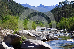 Small river in rocky hills in Col de Bavella mountains, Corsica