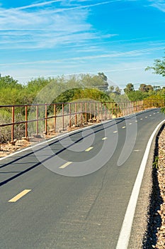 Small road used for emergency vehicles and bicycles or runners and joggers in a camp ground or park area