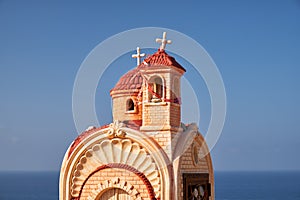 Small roadside chapel (Proskinitari) on the Petra tou Romiou Viewpoint. Limassol. Cyprus