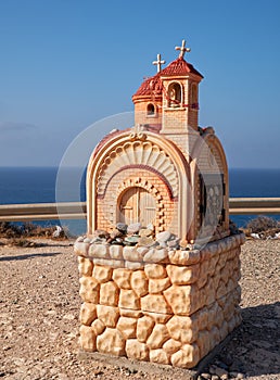 Small roadside chapel (Proskinitari) on the Petra tou Romiou Viewpoint. Limassol. Cyprus