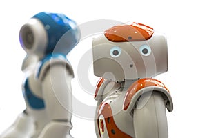 Small robots with human face and body. AI