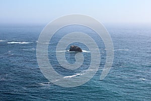 Small rock island in the Pacific Ocean close to Pacific Coast Highway, California, USA