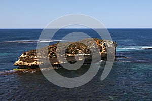 Small rocky island that contains of limestone and bushes, situated on the shore of Port Campbell National Park