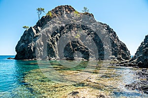 Small rocky islet adjacent to the main land in Cirali hamlet of Antalya, Turkey