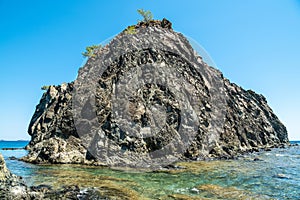 Small rocky islet adjacent to the main land in Cirali hamlet of Antalya, Turkey