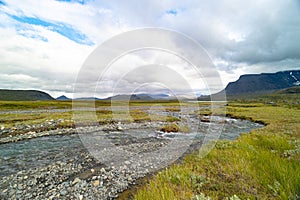 A small, rocky mountain stream in Sarek National Park, Sweden.