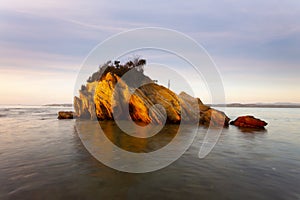 Small rocky outcrop surrounded by water in NSW Australia