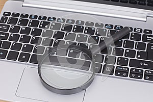 Small round magnifying glass on a laptop