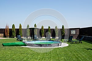 Small round swimming pool in a backyard