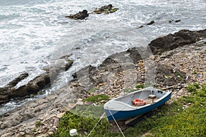 Small rowboat with life buoy