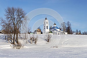 Small russian village with church, winter time