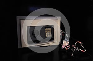 Small safe on shelf in your home or hotel. Personal safe in hotel room with digital code