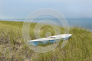 Small Sailboat Sitting in Dune Grass Next to Lake Huron