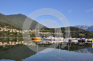 A small sailing boat moor on Caldonazzo Lake. Trentino Alto Adige, Italy