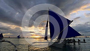 Small sailing boats at the sunset. Boracay, Philippines