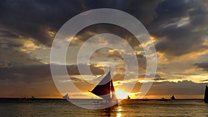 Small sailing boats at the sunset. Boracay, Philippines