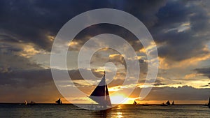 Small sailing boats at the sunset. Boracay, Philippines