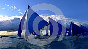 Small sailing boats at the sunset. Boracay, Philippines